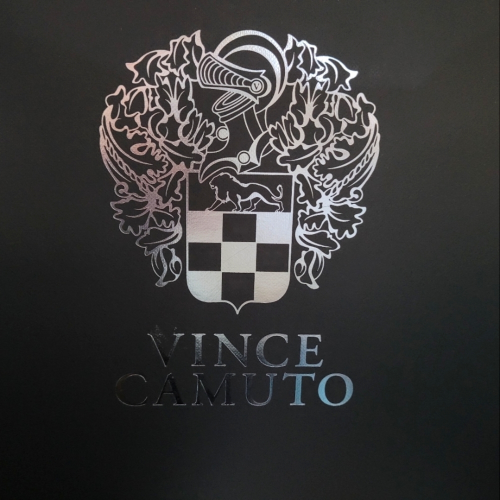 Vince Camuto.               Booties with the cott-out